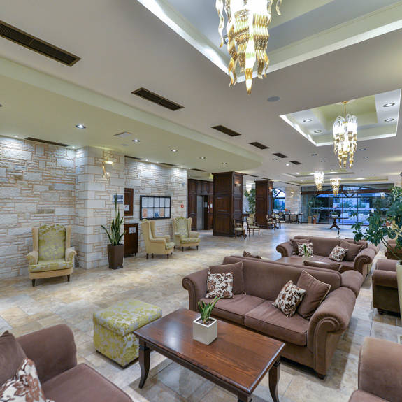 Hotel lobby with double couches and armchairs