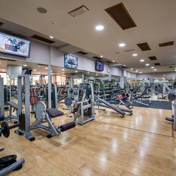 Interior view of hotel gym containing various machines