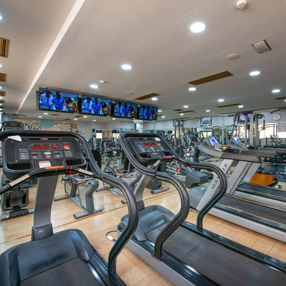 Interior view of hotel gym containing treadmill
