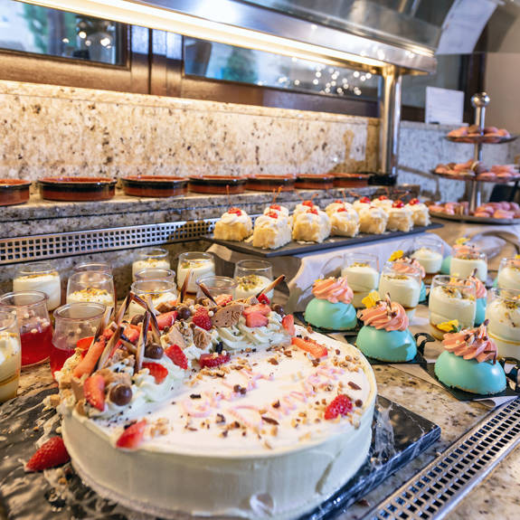 Hotel with a buffet that contains sweets
