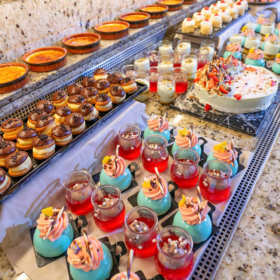 Hotel with a buffet that contains sweets