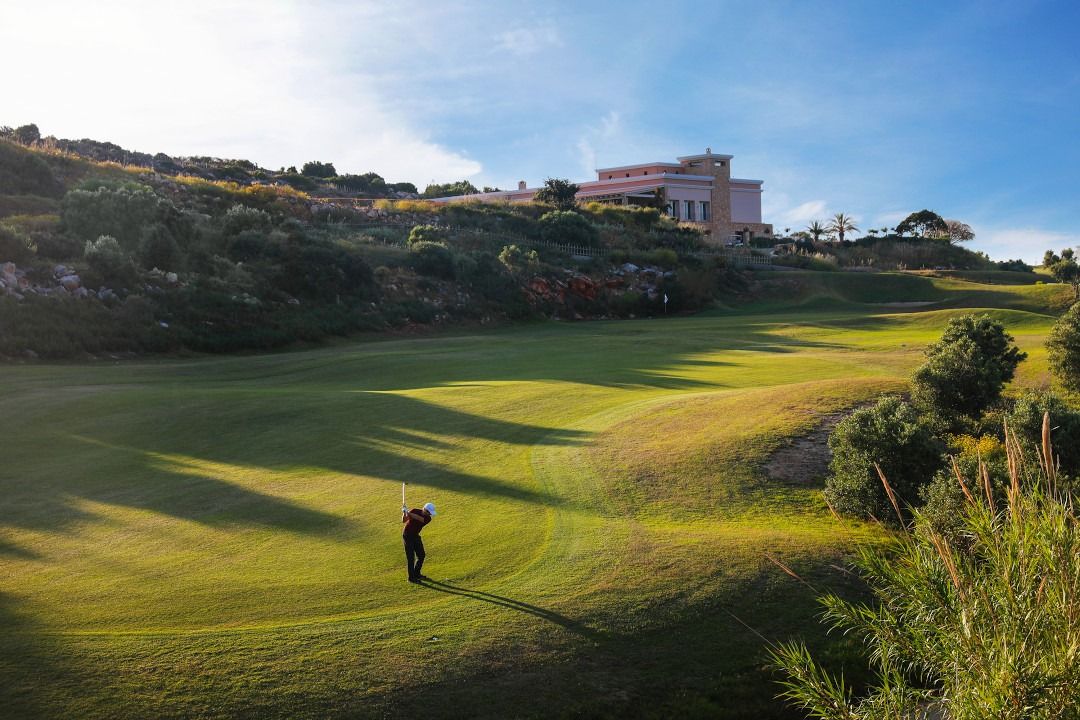 Man playing in a golf course