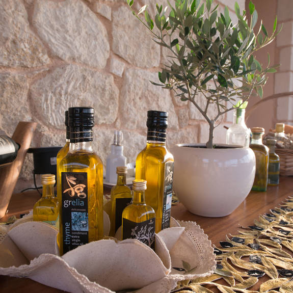 Table with traditional products and an olive in a small pot