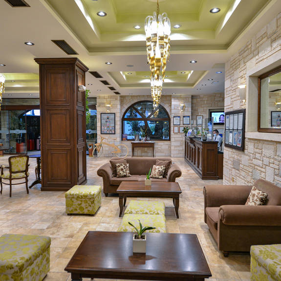 Hotel lobby with couches, armchairs and mirror